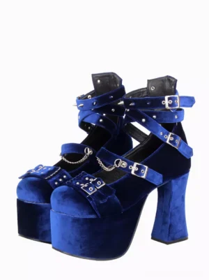 Royal blue velvet Gothic Lolita platform pumps with silver chain decorations and spike studs, front three-quarter view showing multiple adjustable buckle straps and chunky block heel on white background