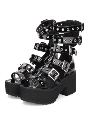 Black gothic lolita platform sandal with grommet buckle straps front three-quarter view showing glossy patent PU upper and peep toe design