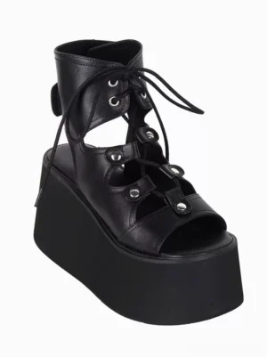 Single black Gothic Lolita platform sandal featuring ankle-high cutout lace-up design with metallic eyelets and chunky platform heel, three-quarter side view