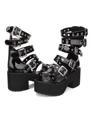 Side profile of black lolita platform sandal displaying high chunky heel and substantial platform sole with silver metal buckles and eyelet grommets