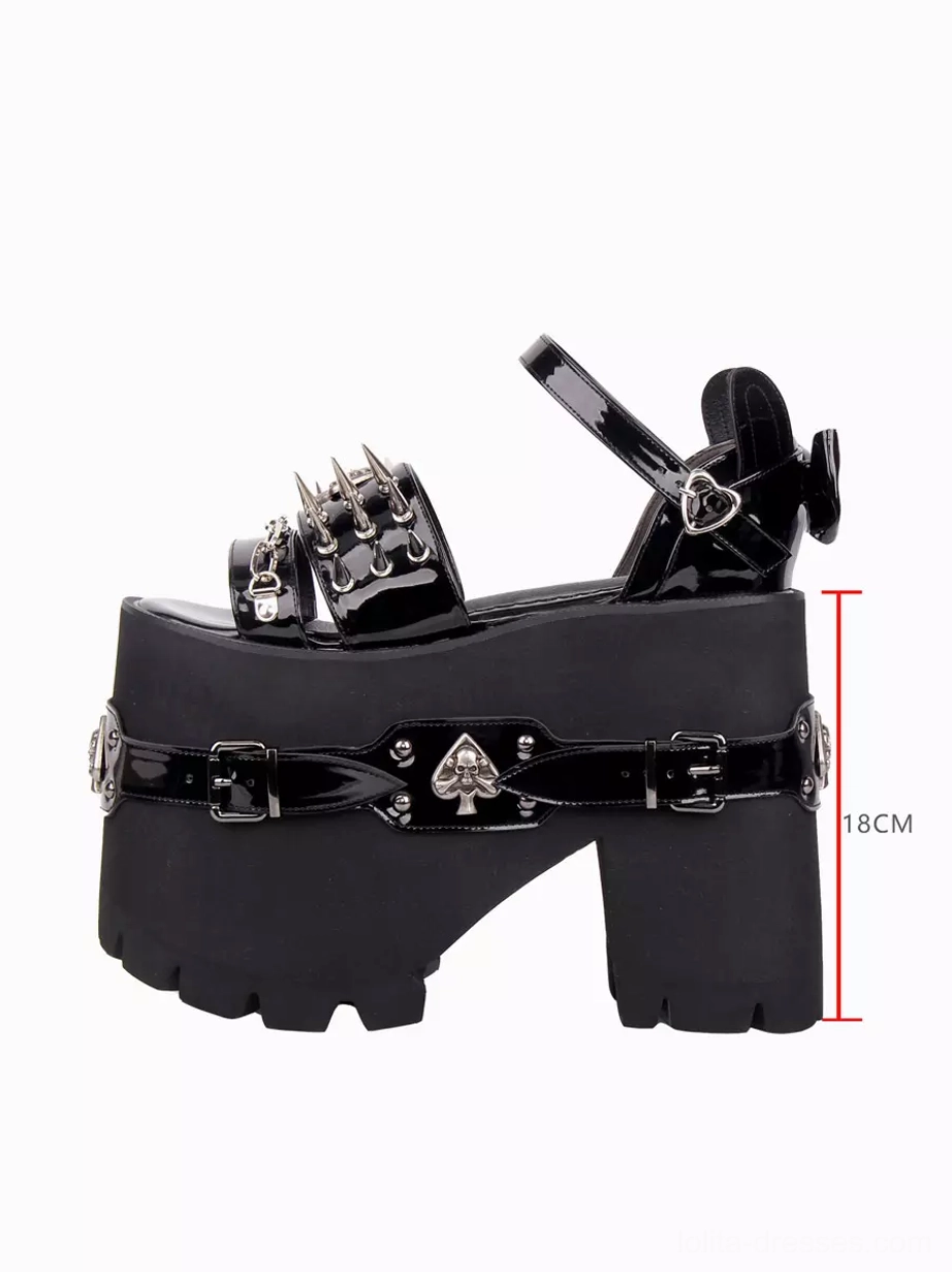 Single gothic lolita platform sandal side profile view with marked 18cm heel height measurement, spade skull belt strap, black PU leather construction, and decorated ankle strap with back bow