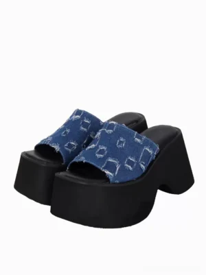 Blue distressed denim Gothic Lolita platform sandals pair front three-quarter view showing peep toe slip-on design chunky black platform sole