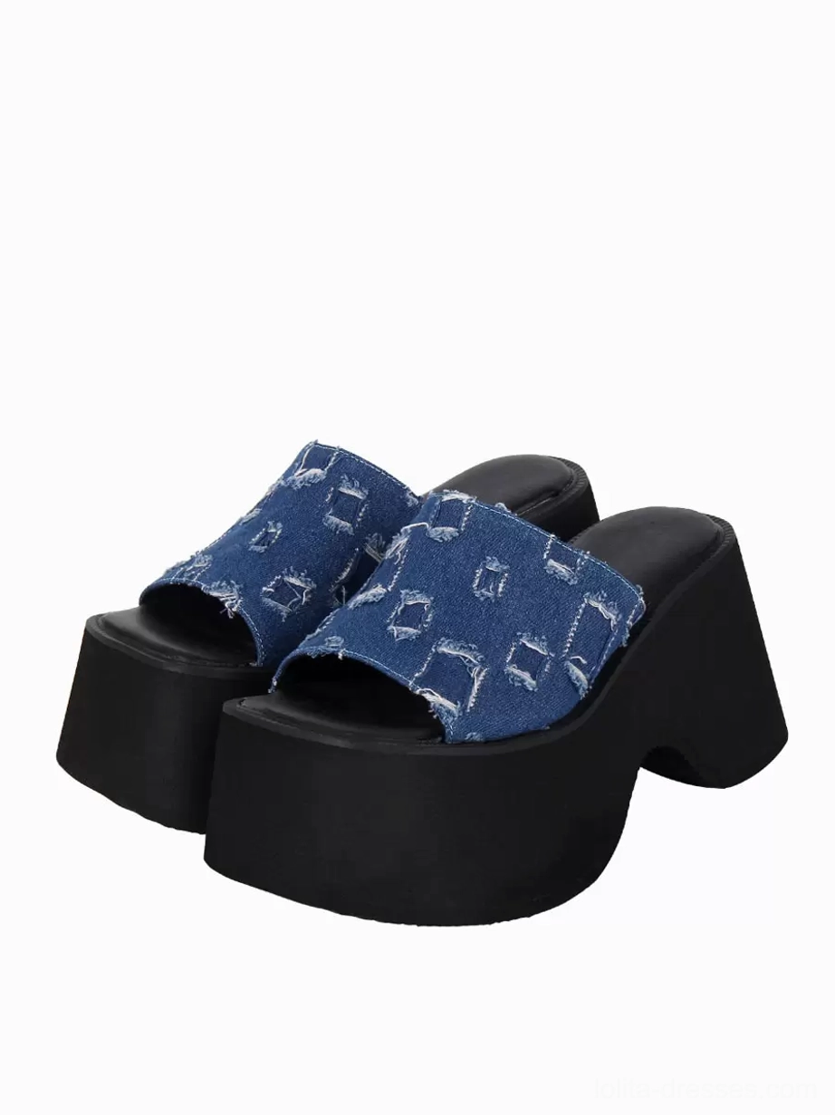 Blue distressed denim Gothic Lolita platform sandals pair front three-quarter view showing peep toe slip-on design chunky black platform sole