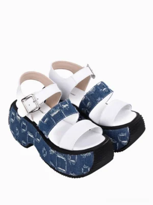 Pair of Gothic Lolita platform sandals side profile view, blue-white color scheme, silver buckle hardware details, distressed denim textured platform visible