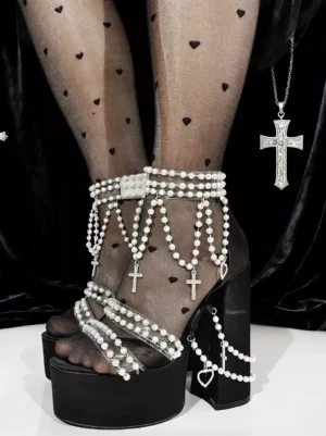 Gothic Lolita sandals worn on feet with black heart-dotted stockings, showing pearl ankle decorations and thick platform heel detail