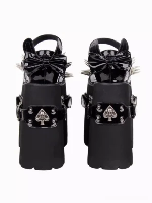 Black gothic lolita platform sandals rear view showcasing patent leather heel bow, spade skull decorative straps, and thick wedge platform sole with metallic details
