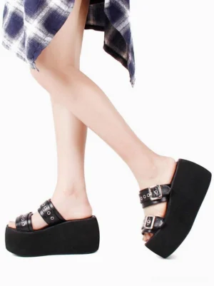 Side profile of gothic lolita wedge sandals displaying thick platform sole and open toe construction with adjustable metal buckle straps