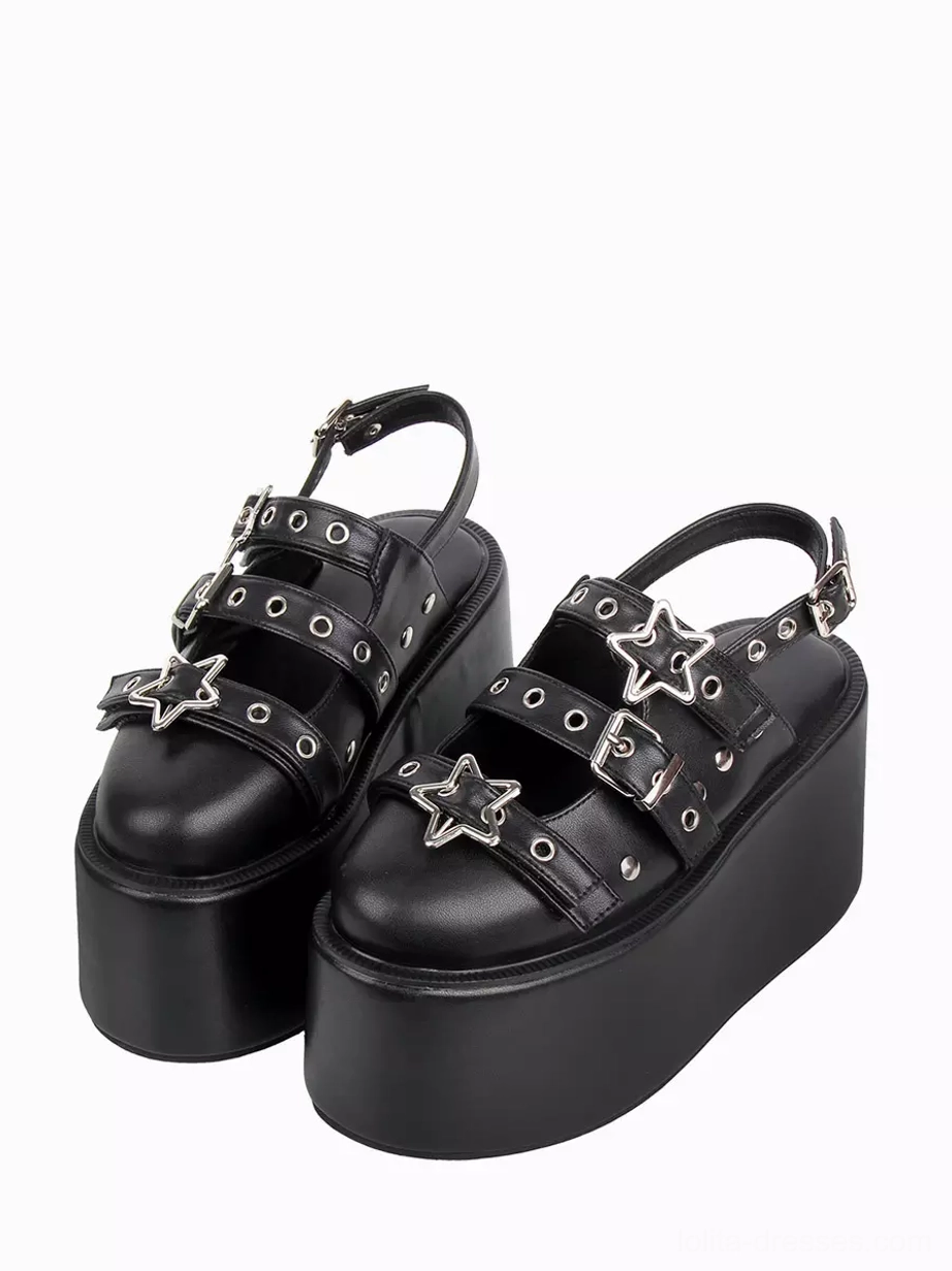 Black Gothic Lolita platform sandals with star metal buckles and grommeted straps front three-quarter view on white background