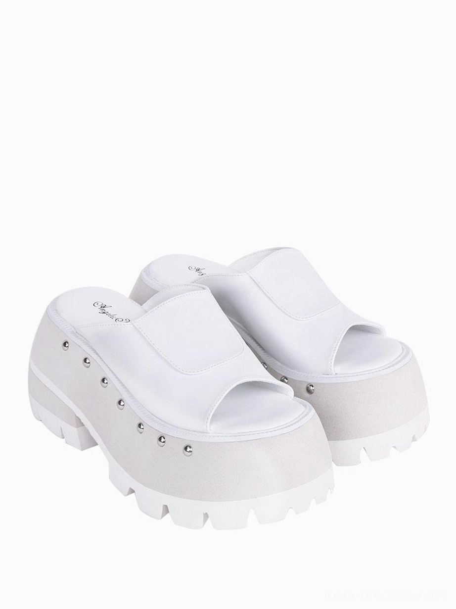 White Gothic Lolita wedge sandals side profile showing platform heel height, serrated sole texture, and rivet details along the strap