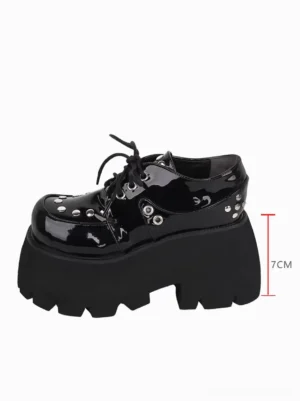 Single Gothic Lolita platform shoe side profile showing 7cm thick platform height, serrated sole design, and metallic rivet embellishments