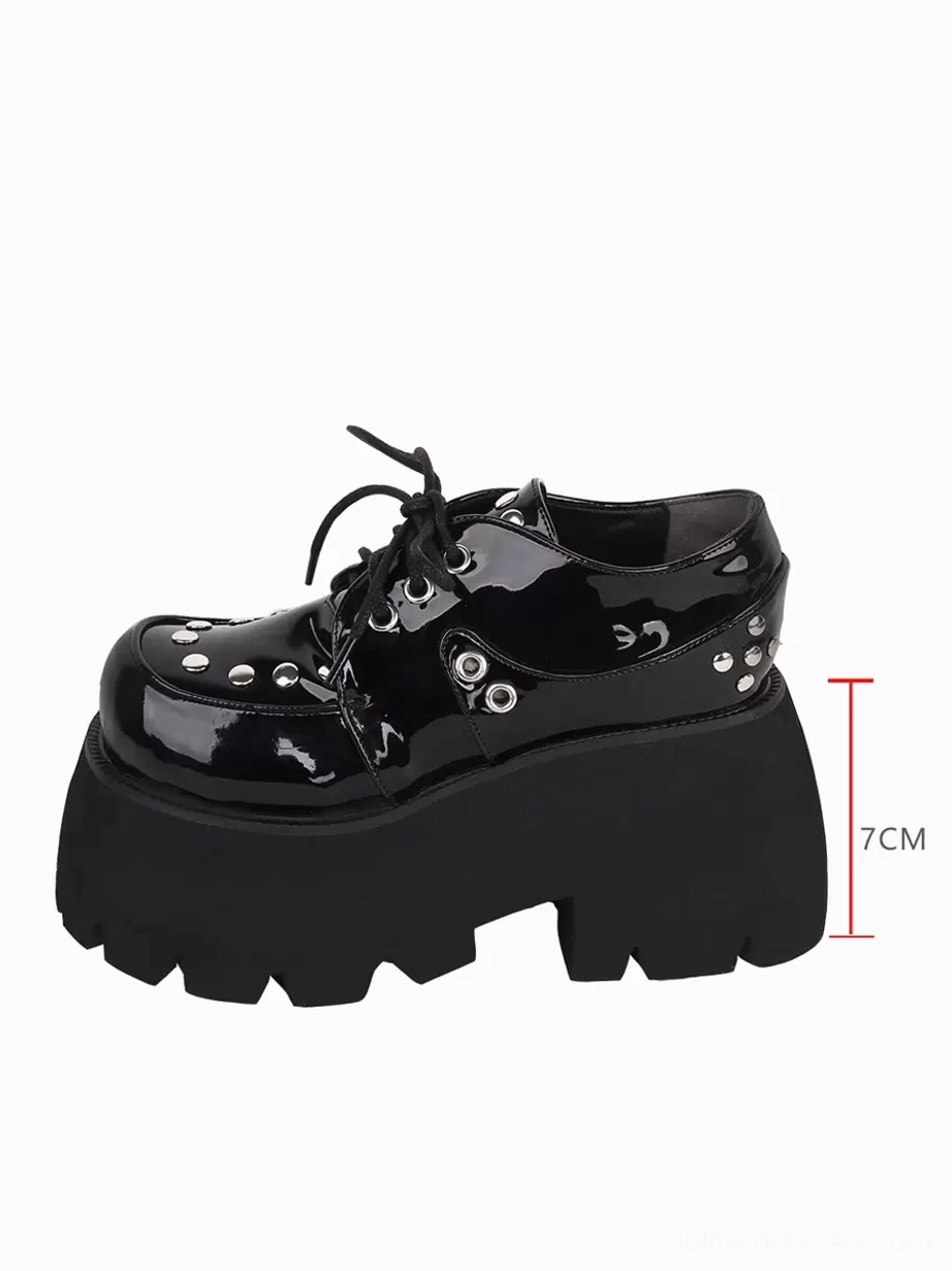 Single Gothic Lolita platform shoe side profile showing 7cm thick platform height, serrated sole design, and metallic rivet embellishments