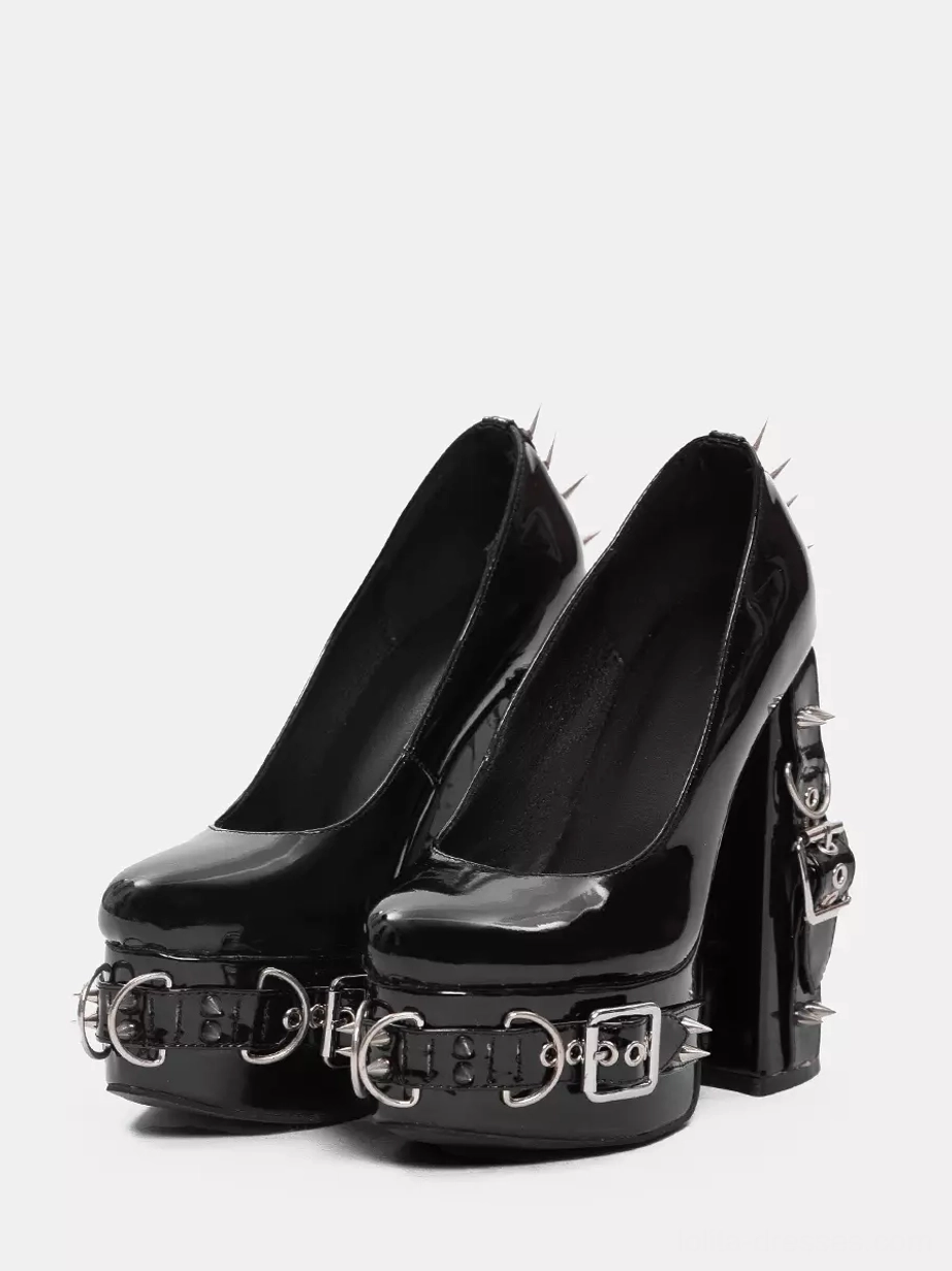 Black patent leather gothic lolita platform shoes with silver rivets and grommets front view static display