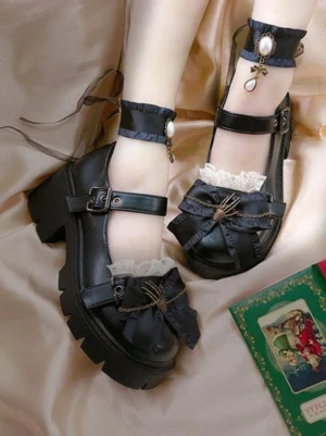 Black gothic Lolita platform shoes worn with skeleton hand bow decor and lace ankle cuffs, top-down view on vintage satin backdrop, showcasing pearl-decorated straps and block heel