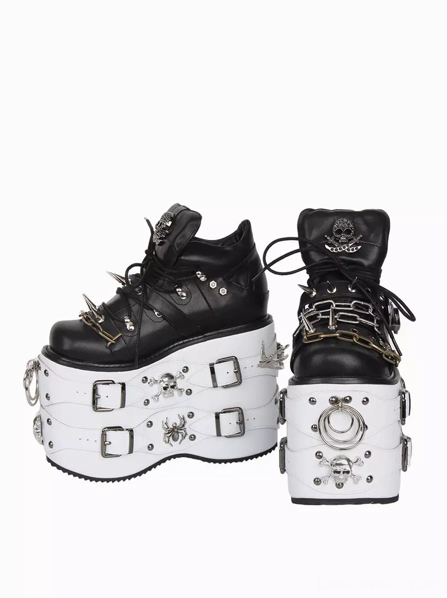 Paired Gothic Lolita platform shoes mixed front and rear view one shoe shows front metal hardware other shows rear skull logo white sole with square buckles metal embellishments