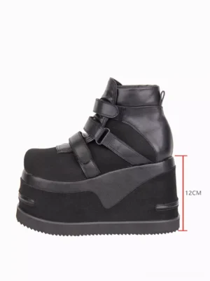 Single black Gothic Lolita wedge boot left side three-quarter view displaying 12cm marked heel height and serrated rubber outsole