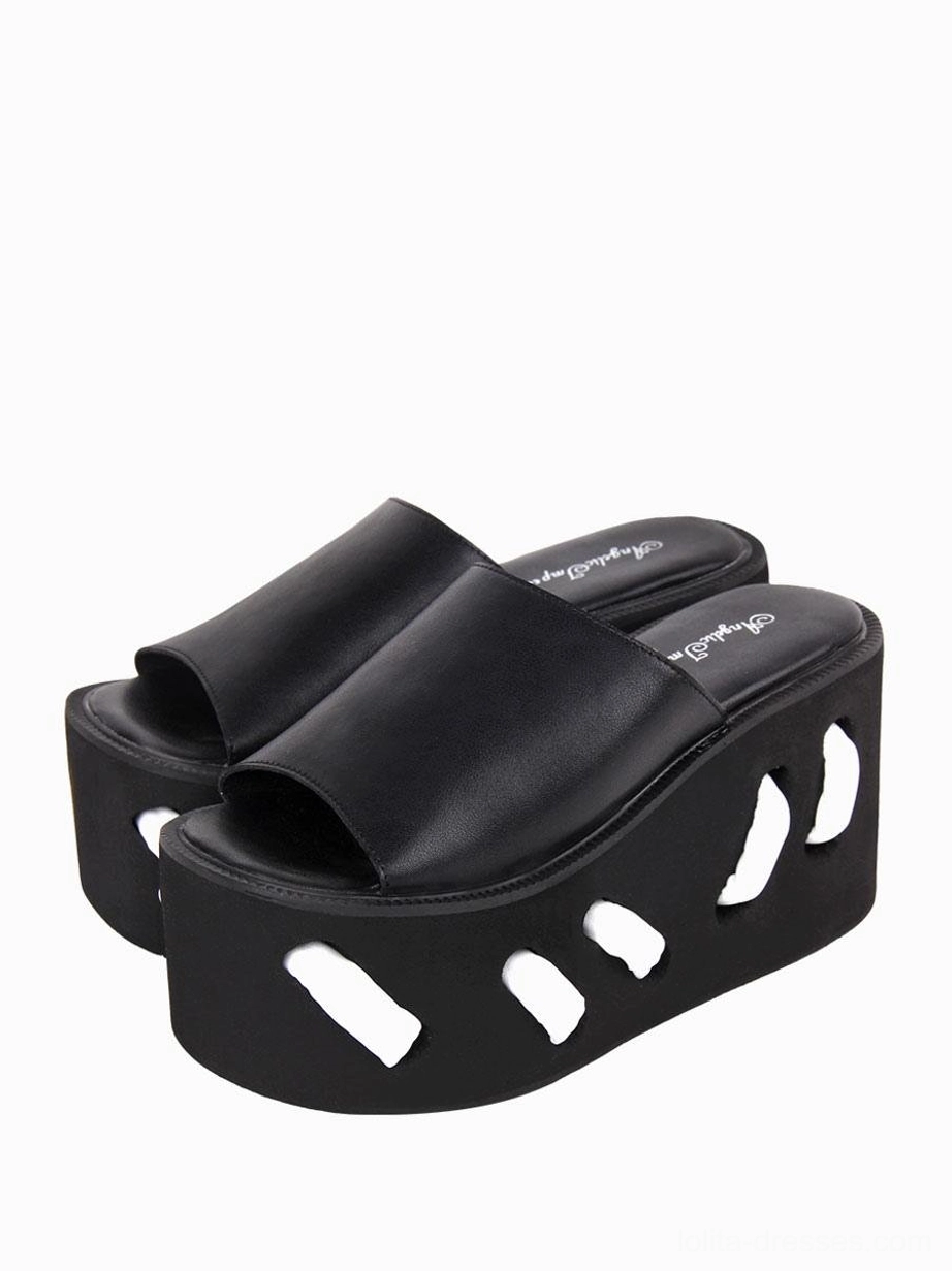 Black gothic lolita platform sandals alternative front angle view showcasing geometric cutout pattern on wedge sole and round open toe silhouette