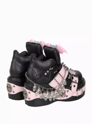 Black gothic lolita platform wedge shoes rear paired three-quarter view showing hanging skull chain ornaments and thick wedge sole construction