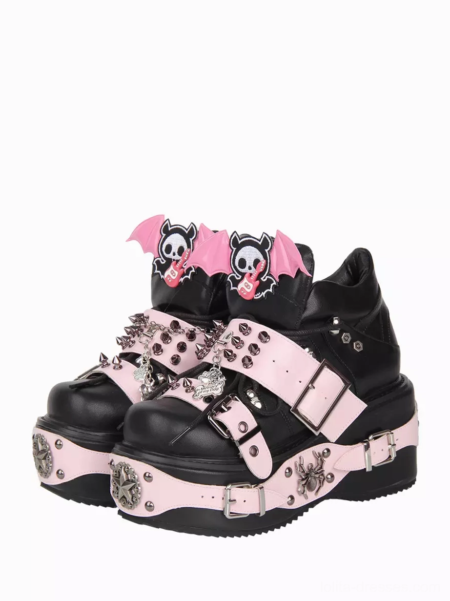 Black gothic lolita platform wedge shoes front paired three-quarter view with pink buckle straps and bat skull charms detailed ornaments