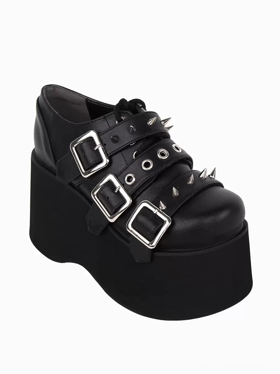 Single black gothic lolita platform pump with round toe, eye-level side profile showing wedge heel height, silver metallic embellishments, and platform sole construction