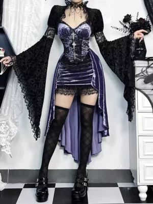 Gothic lolita purple velvet dress set back three-quarter view model wearing dark purple velvet slip dress with black lace-trimmed cover-up long sleeves fishnet stockings studio gothic setting