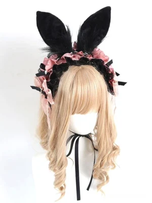 Gothic lolita rabbit ear headwear with black and pink plush ears, ruffled lace trims, and delicate details on blonde curly wig mannequin with black neck ribbon
