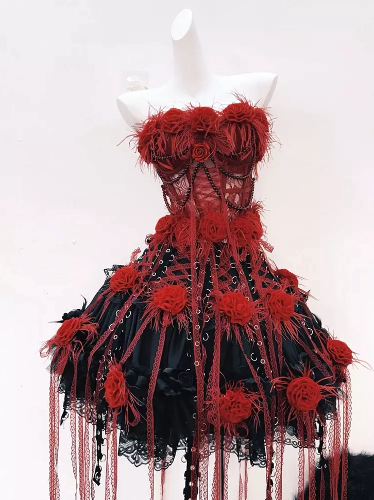 Gothic lolita strapless red black vest skirt set full front view on mannequin featuring feather adorned bustier with beaded chain accents and dramatic rose tassel embellishments