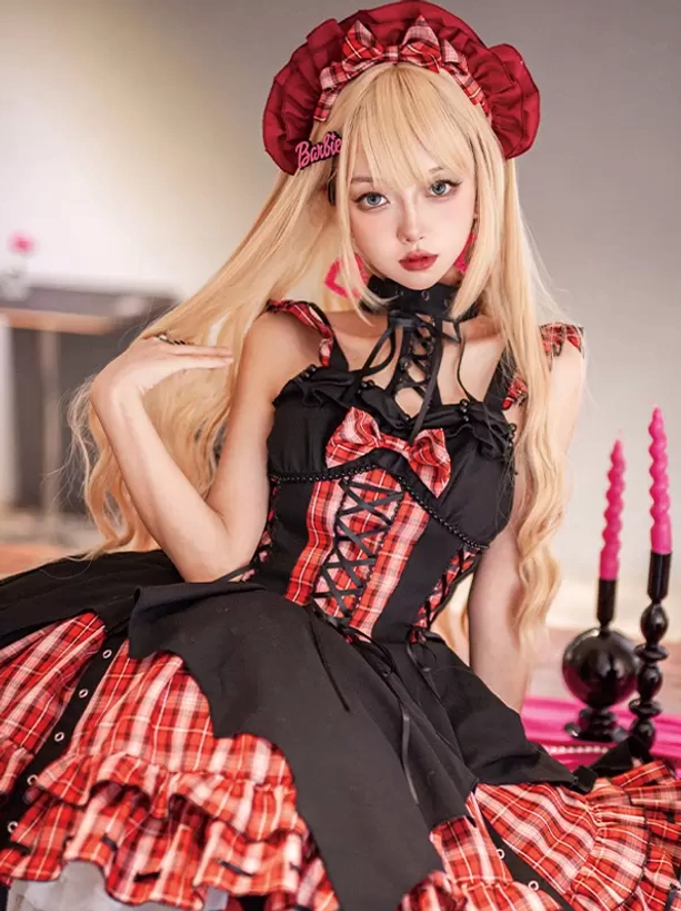 Red plaid Gothic Lolita dress with asymmetric bat-style hem, lace-up corset, worn by model with red beret indoors