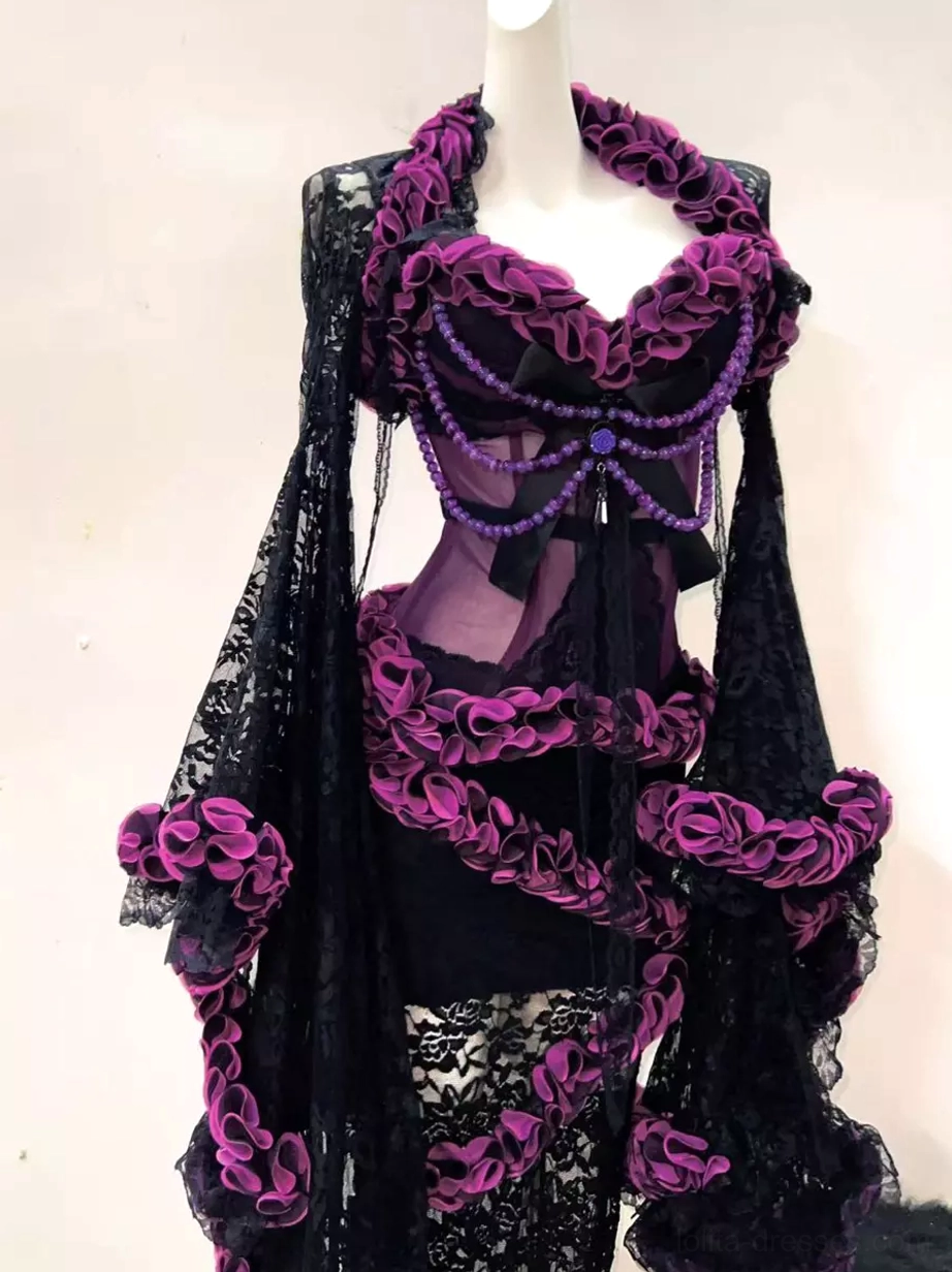 Close-up front view of gothic ruffle lace lolita top on mannequin showing large ruffled collar heart-shaped neckline with purple bead bow decoration and sheer purple fabric