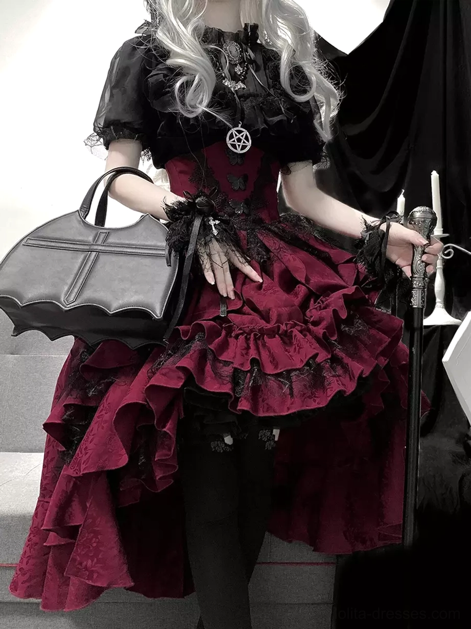 Gothic lolita clothing ensemble back view displaying wine-red high-low ruffled skirt with jacquard fabric, black short-sleeve lace-trimmed blouse, and pentagram jewelry details