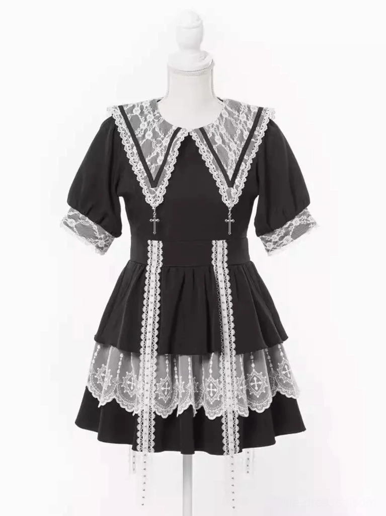 Gothic lolita sailor dress close-up detail shot showing lace splicing construction cross pendant embellishment and quality fabric craftsmanship