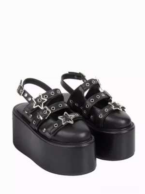Pair of black gothic lolita platform sandals side three-quarter angle showing 10cm thick wedge heel and closed round toe design
