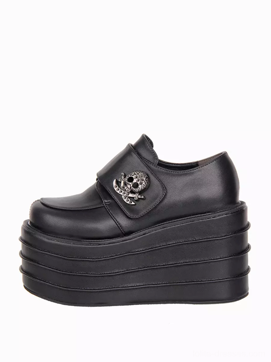 Single gothic lolita platform shoe left side profile displaying PU leather upper texture, hook-and-loop strap fastening system, and skull metal decor detail