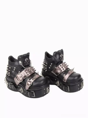 Gothic lolita shoes side view showcasing metal rivets skull embellishments and chain details on black leather platform wedge