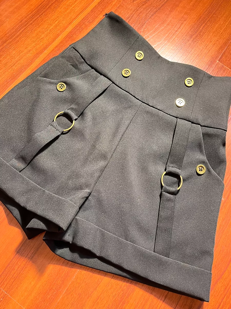 Black Gothic Lolita shorts high-waisted flat lay top-down view metal buttons d-rings solid dark fabric detail