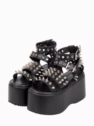 Gothic lolita studded platform sandals front three-quarter view showing black PU leather with spike rivets and adjustable ankle buckle straps on white background