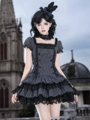 Gothic lolita dress set full front view featuring black and white striped pattern with square neckline and puff sleeves worn by model in front of gothic church background