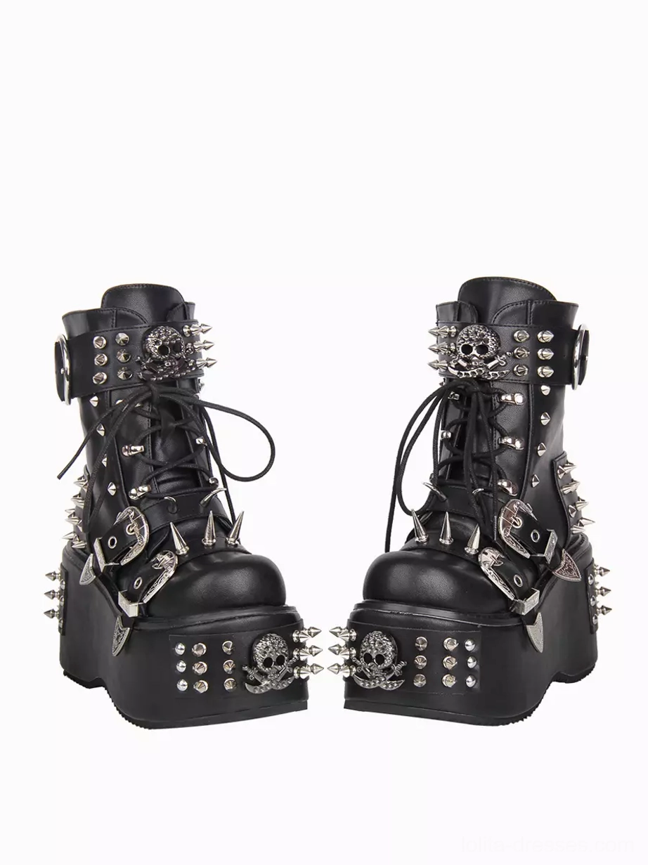 Paired punk studded platform boots front three-quarter view lace-up closure metal skull spike stud decorations thick platform heels Gothic style