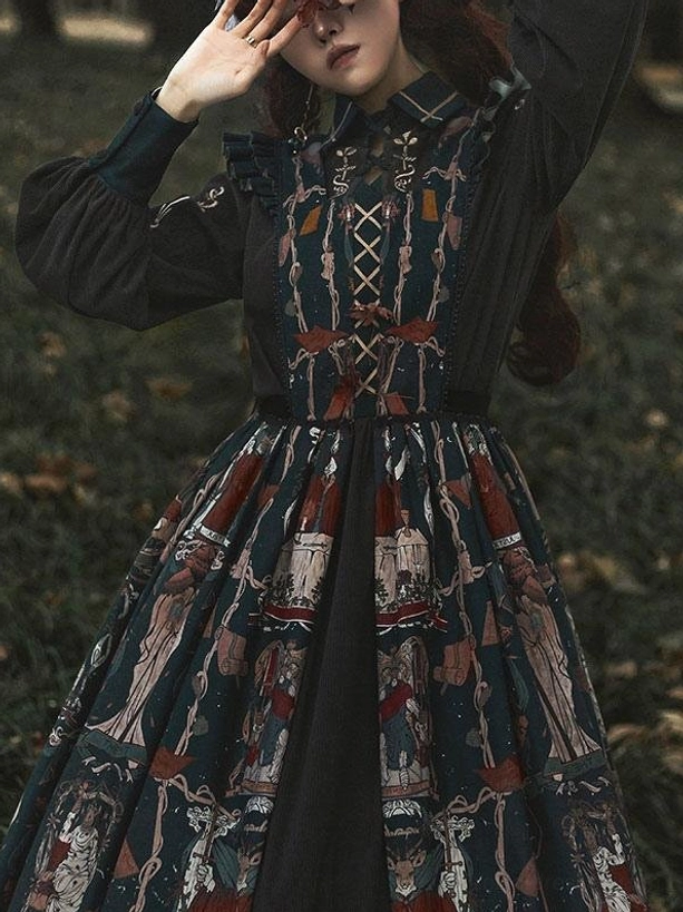 Close-up of Gothic Lolita dress bodice and upper body detail on model with brown hair outdoors, featuring lace-up corseting and tarot pattern fabric