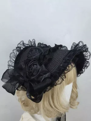 Black Gothic Lolita bonnet left side view showing all-black design with satin rose decorations and sheer lace trim