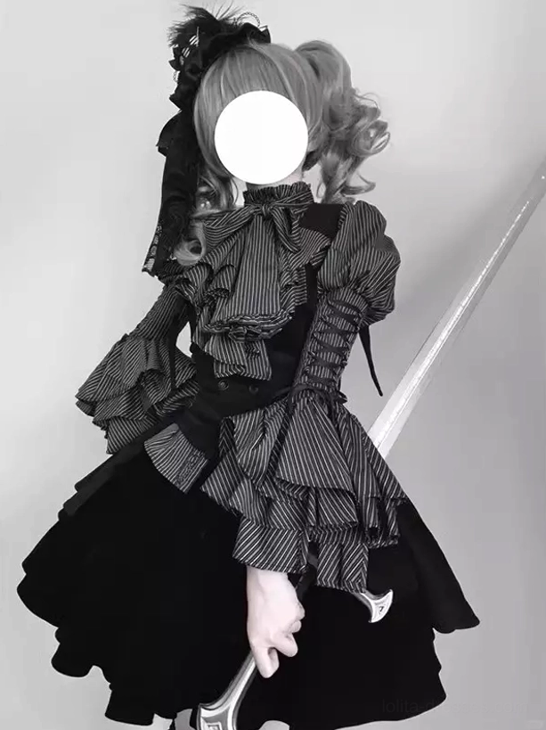 Gothic Lolita 3-piece outfit set rear three-quarter view showing striped ruffled long sleeve blouse, fitted black waistcoat, and tiered layered mini skirt with lace accessories