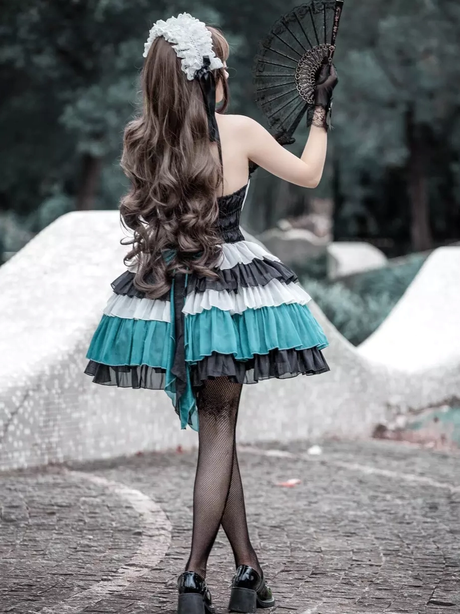 Gothic Lolita tiered ruffle color-block dress back three-quarter angle model holding fan layered design