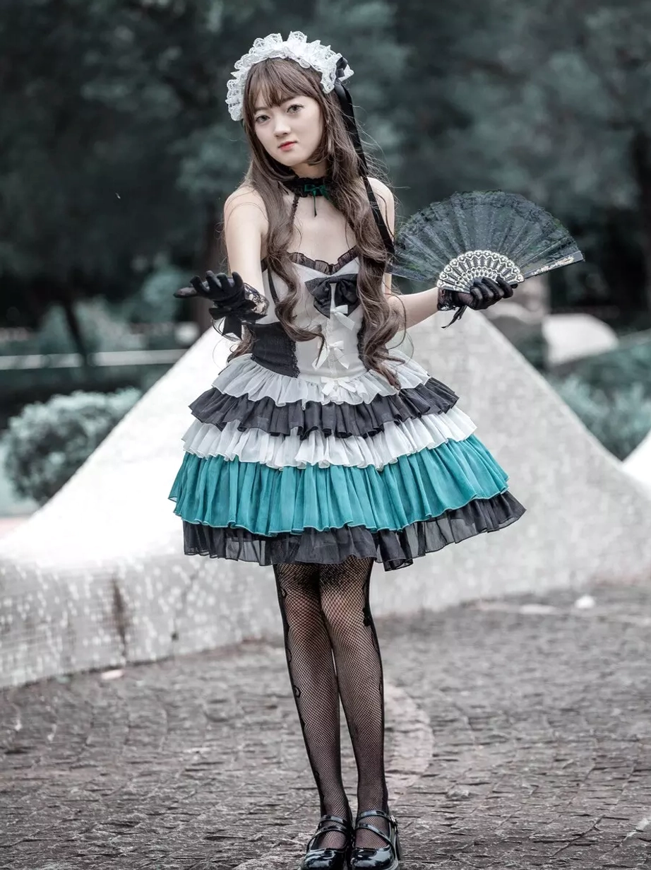Gothic Lolita tiered ruffle color-block dress front angle outdoor model holding decorative folding fan