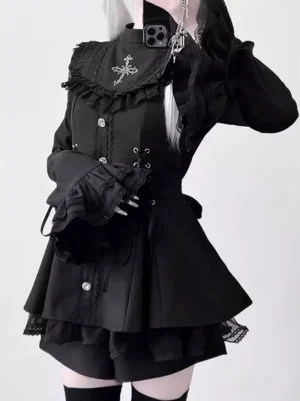 Gothic lolita fitted top and shorts set front close-up detail shot showing ruffled cuffs corset side lacing and cross brooch accent