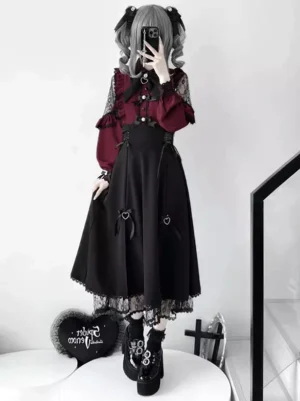 Gothic lolita two-piece set full-body front view featuring wine red long-sleeve lace shirt with black lace details and black high-waist skirt with heart bow decoration and lace-up side straps