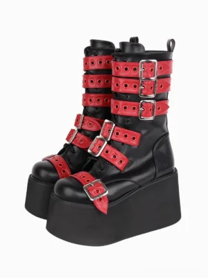 Two-tone gothic lolita boots with black and red accent straps, front three-quarter paired display, polished silver buckles, eyelet details, chunky platform sole, edgy alternative style footwear