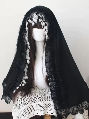 Gothic Lolita hooded veil front oblique angle showing double-layer black and white lace edges on mannequin with dark brown wig