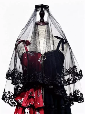 Gothic lolita head veil flat display on mannequin with complete gothic lolita dress coordinate, showing black sheer tulle double lace edging and bow accents with built-in hair comb