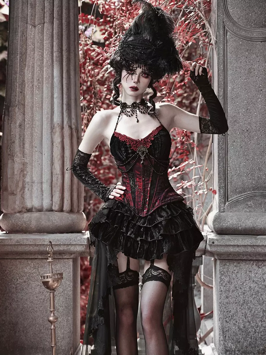 Gothic lolita corset dress set three-quarter side view showcasing long black gloves thigh-high stockings feathered headdress and ruffled skirt