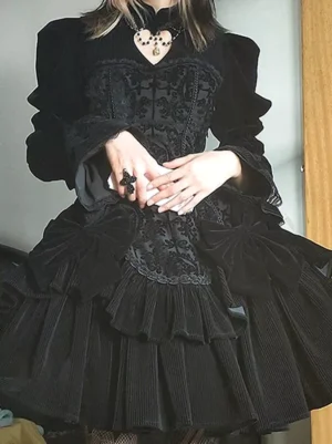 Black velvet gothic lolita dress with heart neckline cutout embroidered bodice and ruffled layered skirt front half-body mirror view