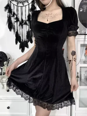 Gothic Lolita velvet dress three-quarter front view showing fitted waist A-line silhouette, lace hem trim, and lace-trimmed short puff sleeves